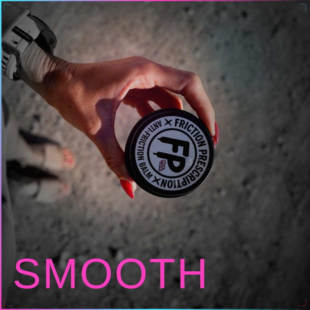Athlete holding Friction Prescription anti-friction balm tin on a gravel trail