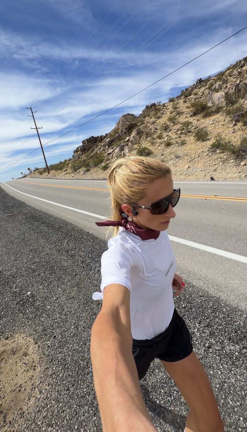 Whitney Dancaster running The Speed Project — desert highway in California